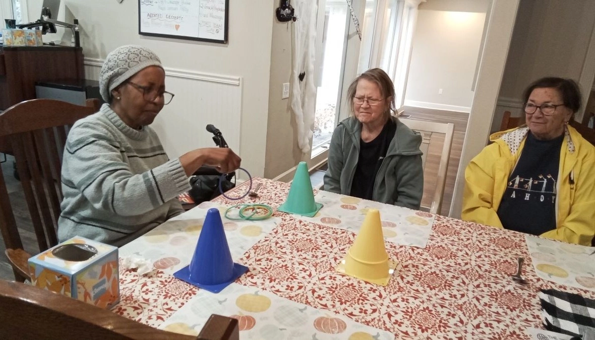 Senior residents playing a game together at a senior care community