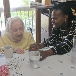 Nurse providing care and support to a senior resident at a senior care community